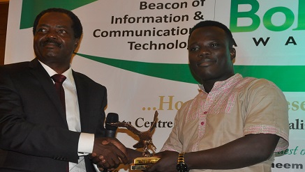 Israel Bolaji, Public Relations Manager, StarTimes(r) receiving Pay TV operator of the Year at Beacon of ICT Awards 2016 from Engr. Lanre Ajayi, president, ATCON.